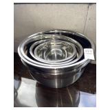 Several stainless steel nesting mixing bowl set