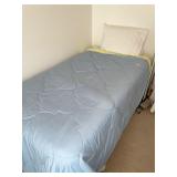 Twin bed with bedding