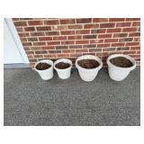 4 flower pots outside downstairs