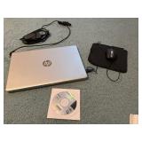 HP laptop computer with cord and mouse