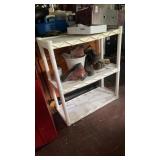 White plastic storage shelf w boots