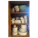 3 Shelves of plates, bowls, measuring cups