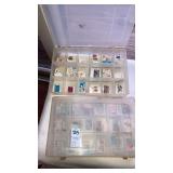 (2) organizers of loose postage stamps to collect