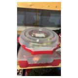 Two Christmas Wreaths In Cases