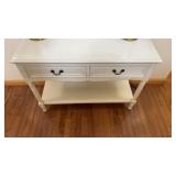 A traditional-style console table, distressed