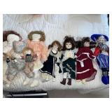 Porcelain dolls & variety of plush