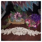 Assorted faux flowers, wicker basket