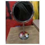 Dual faced mirror- one side magnified