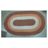 Multi colored braided oval rug, 31' x 50'