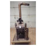 Camping tent stove w/heat activated fan