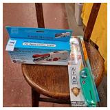 Handheld sewing machine, scripto Aim n flame