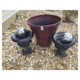 Large plastic pot and two concrete urns with