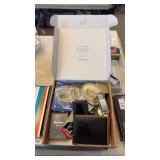 VHS Tapes and Belt Buckles