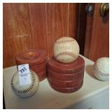 Two wooden baseball holders,3 baseballs