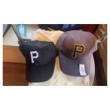 Two Pittsburgh Pirates caps