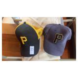 Two Pittsburgh Pirates caps
