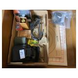 Paper targets, small binoculars, gun cleaning