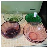 Four glass round bowls
