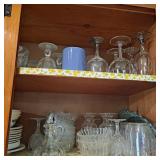 Two shelves of assorted plates,coffee