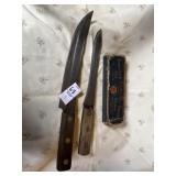 Two butcher knives, sharpening stone