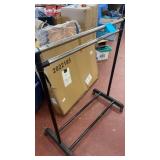 Adjustable wheeled clothing rack