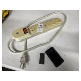 Two Apple iPods, power strip