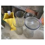 Four glass vases, one ceramic vase