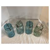 Four lidded quart canning jars, blue and light