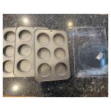 Three nonstick fluted mini tart pans, glass