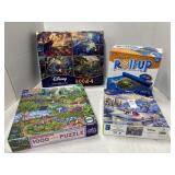 Three puzzles and a puzzle roll up storage mat