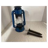 Dietz lantern and two railroad spikes