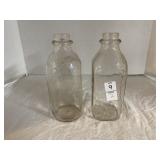 Two Gallikerï¿½s milk bottles, 9 inches tall