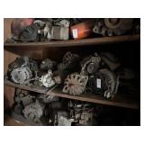 Shelf Lot of Alternators and Car Parts