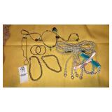 Pierced hoop earrings, pearl hairclip, bracelets,