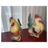 2 rooster figurines