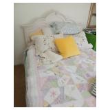 Bedding and pillows on bed only