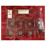 Eight buffalo nickels, one 1935, six 1936, one