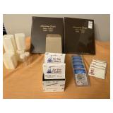 Various coin containers and books