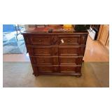 brown wooden 8-drawer dresser with diamond-shaped