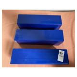 Three blue plastic storage boxes designed to hold