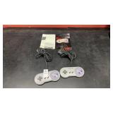 Lot of 2 SNES Controllers and Manuals