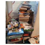 All books on floor and behind mattress
