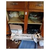 Cabinet and contents inside and on floor. No
