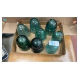 Vintage green glass insulators