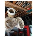 Shelf lot of  rolled rubber etc