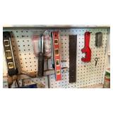 Pegboard contents, wrenches, levels, scissors,