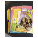 Books, baby shoes