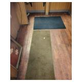 2 rugs brown rug is 60in. X 24in. Black rug is