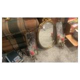 Vanity mirror features ornate gold-toned frames