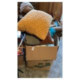 Box of pillows and bedding